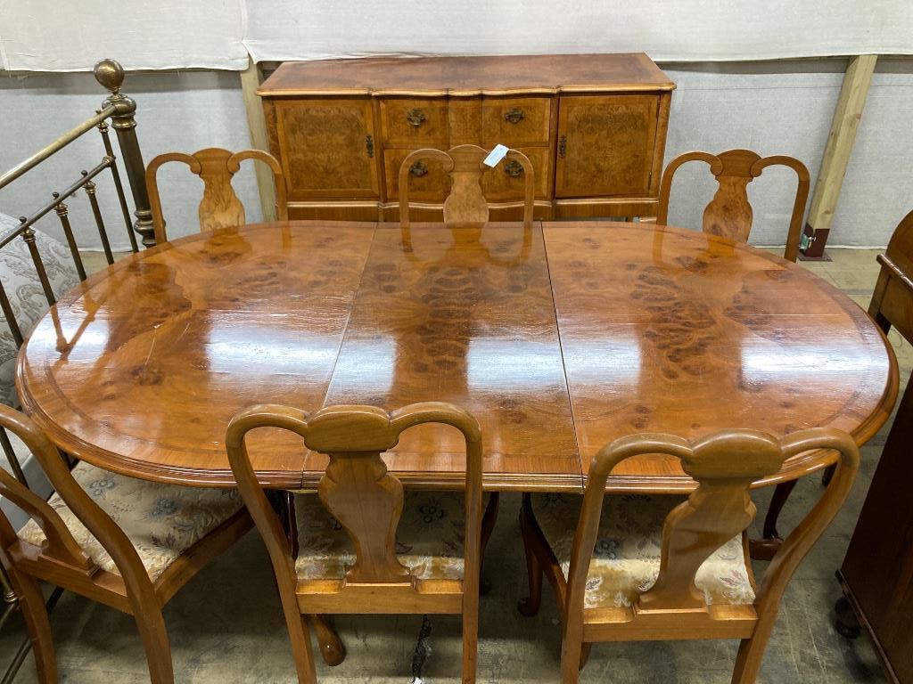 A Berwick Furniture Queen Anne Revival walnut dining suite, comprising a sideboard, an extending twin pillar dining table and six chairs, sideboard width 154cm depth 54cm height 90cm